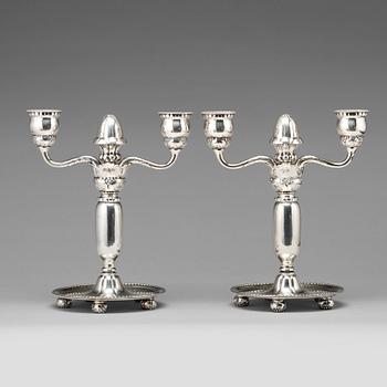 122. Georg Jensen, a pair of 830/1000 silver two light candelabra, Copenhagen 1918, model nr 93.