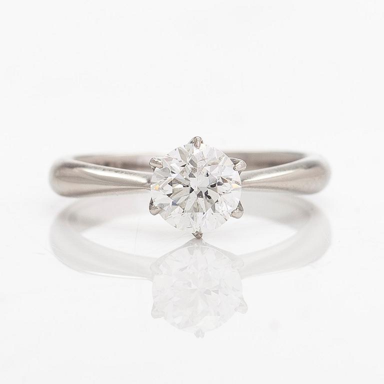 A platinum ring, with a brilliant-cut diamond approximately 1.00 ct according to the engraving.