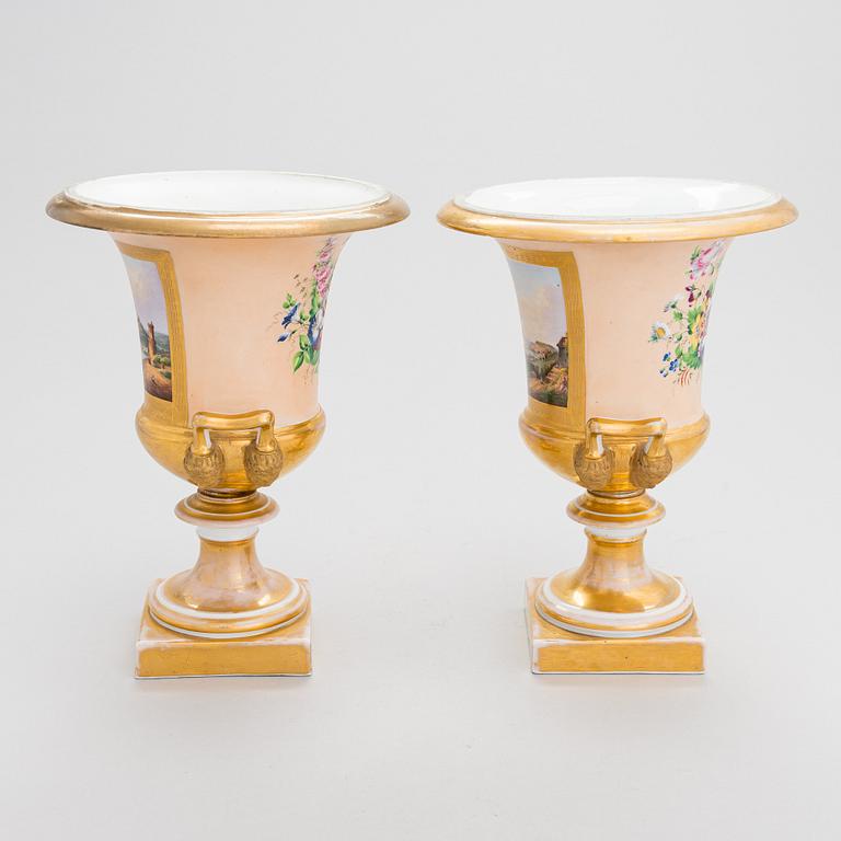 A pair of German porcelain urns from around the mid-19th century.