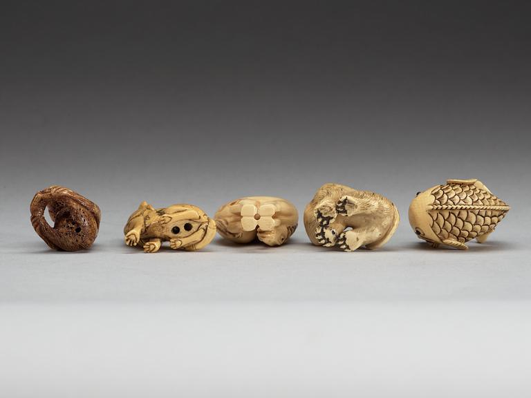 A set of eight Japanese ivory and bone Netsukes, Meiji period.