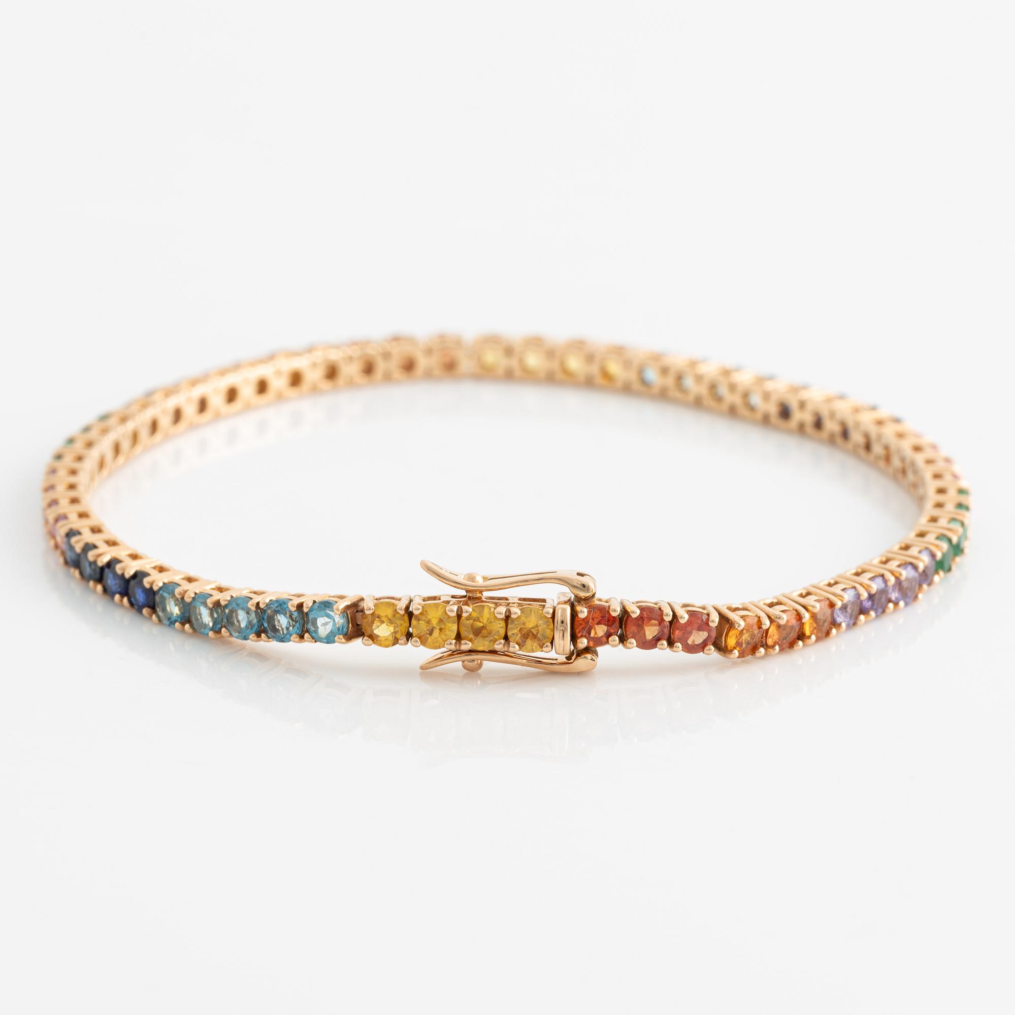 Bracelet 18K gold with faceted emeralds and sapphires in various colors.