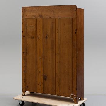 A early 20th century Jugend Cabinet veneered with oak.