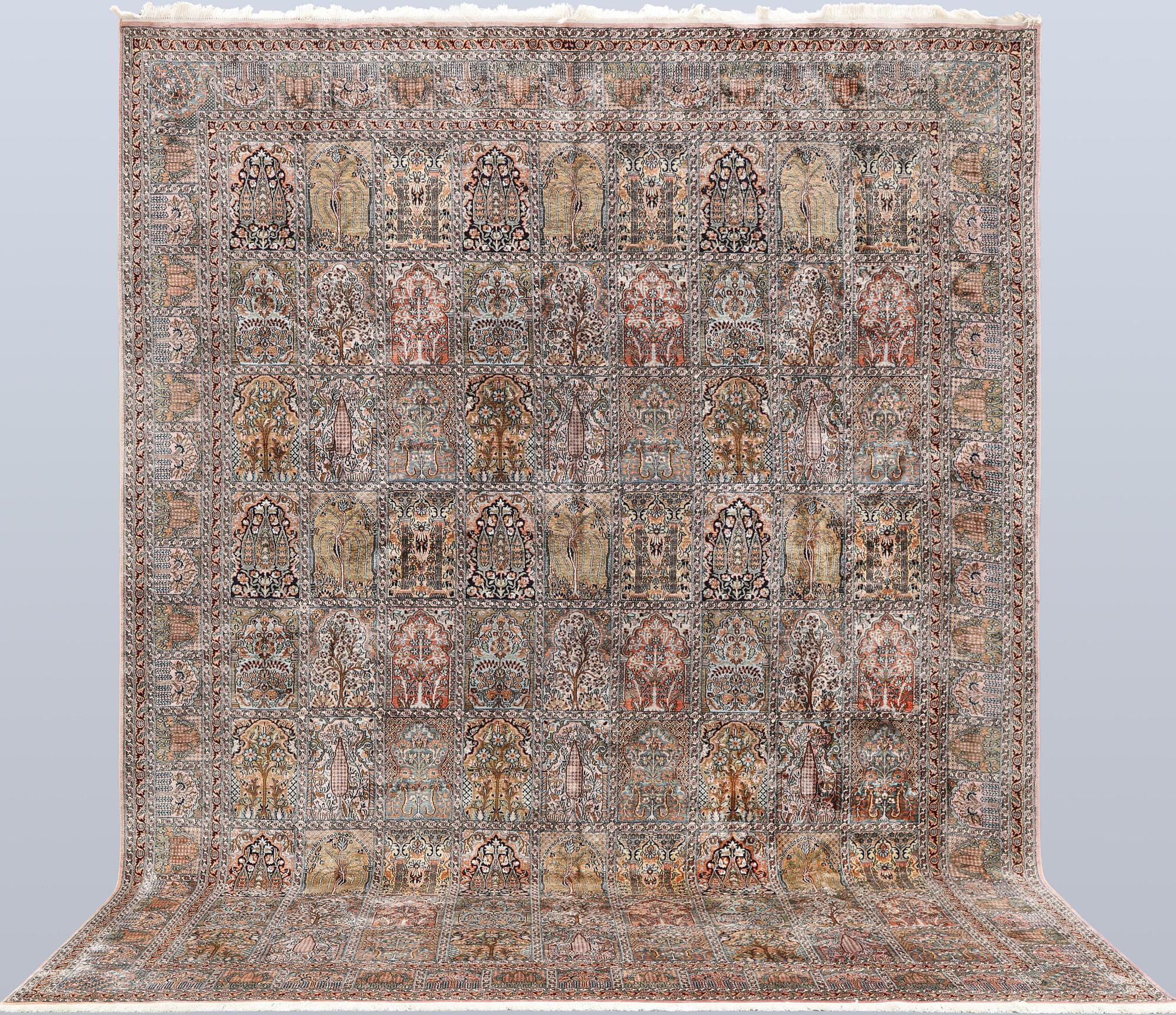 A Kashmir silk carpet, 418 x 297 cm.