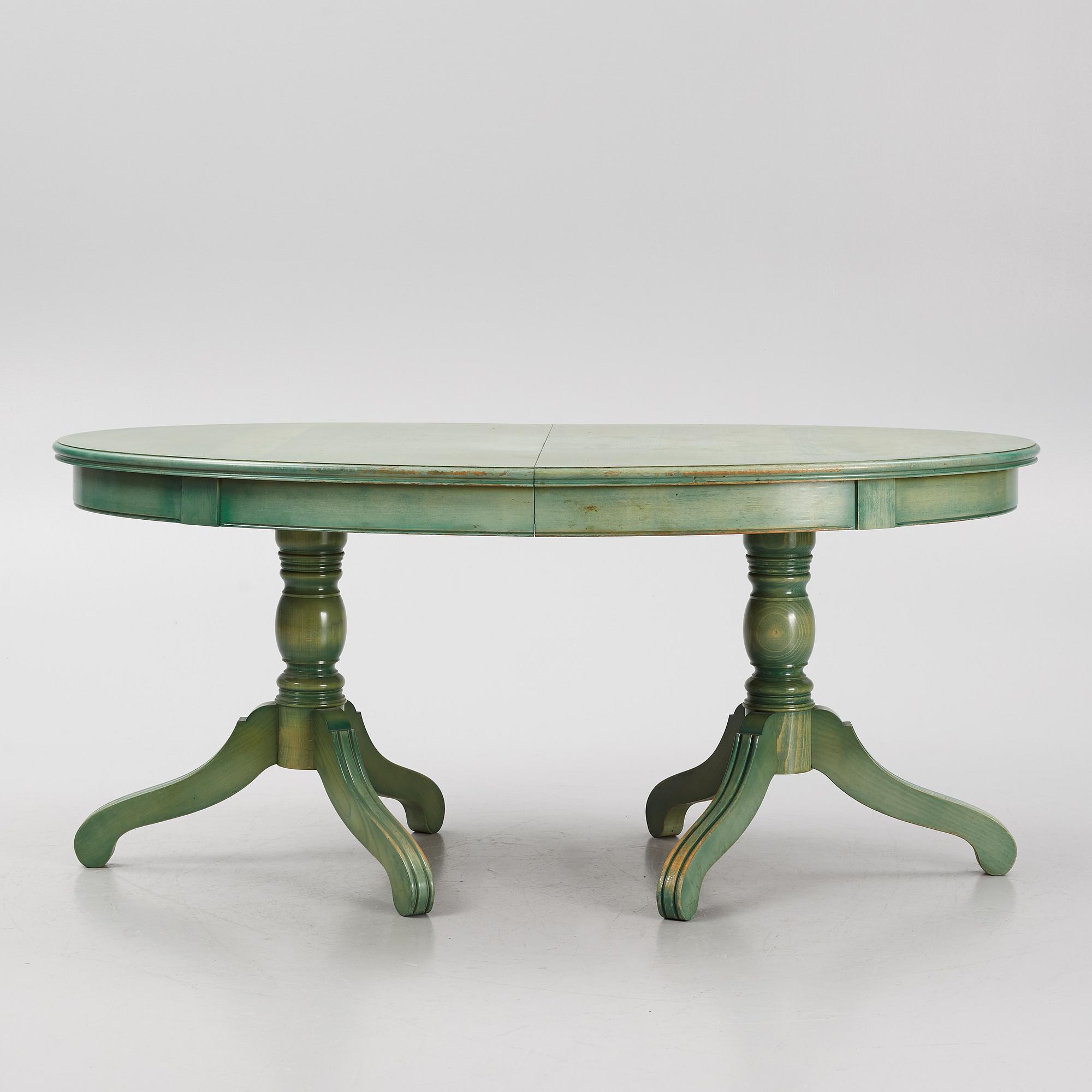 A dining table with eight chairs, Grange, France, late 20th century.