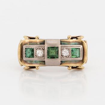 A ring with green tourmaline and brilliant-cut diamonds.