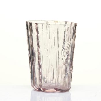 An amethyst coloured suger shaker and a cut glass goblet, 18th century.