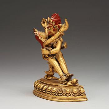 A gilt bronze figure of Vajrapani with consort in yabyum position, Nepal/Tibet, presumably early 20th Century.