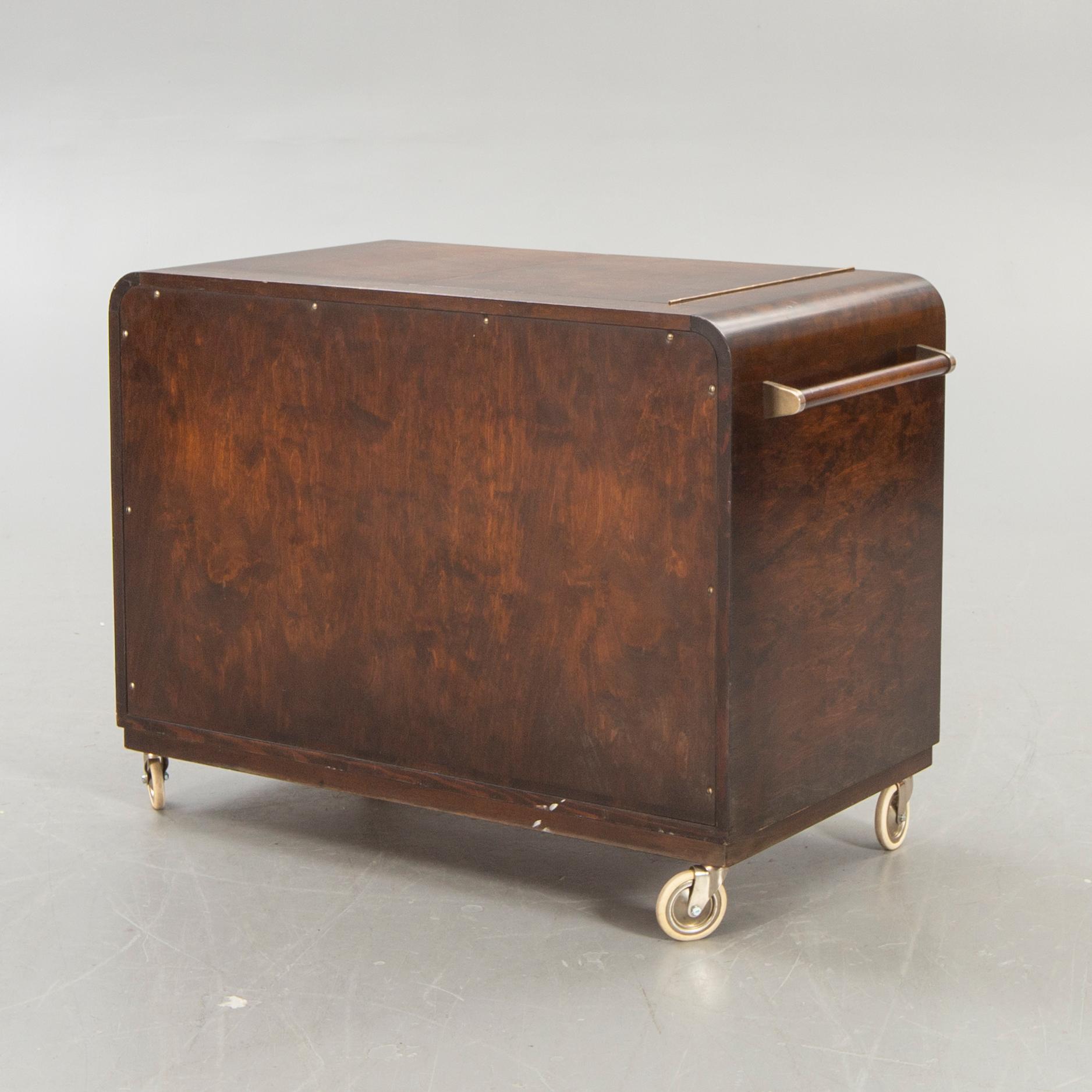 A stained birch bar cabinet from NK dated 1936.