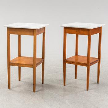 A pair of birch and marble bedside tables, early 20th Century.