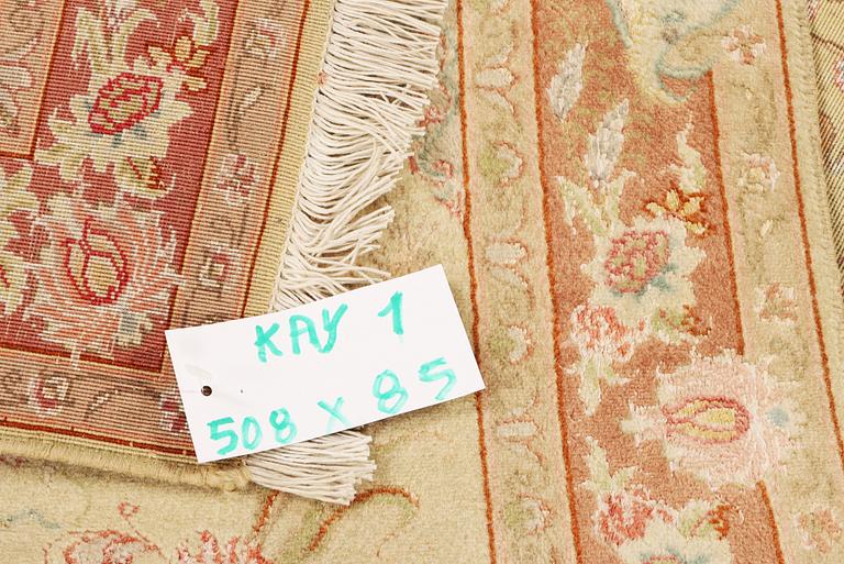 A Tabriz carpet, part silk, 50 raj, a. 508 x 85 cm.