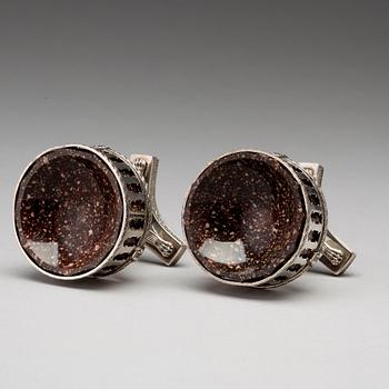 A pair of Swedish 19th century porphyry and silver salt-cellars, silver with mark of Gustaf Folcker, Stockholm 1823.