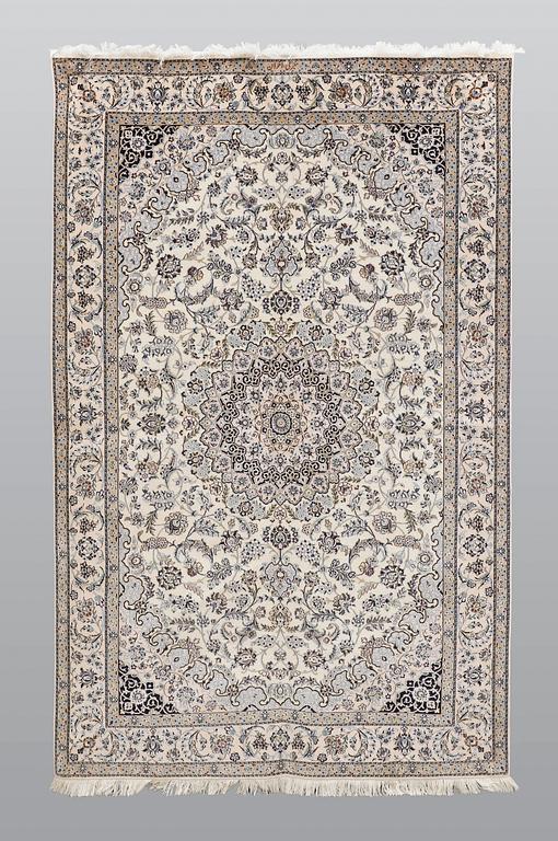 A carpet, Nain part silk so called 6 LAA, signed, ca 240 x 137 cm.