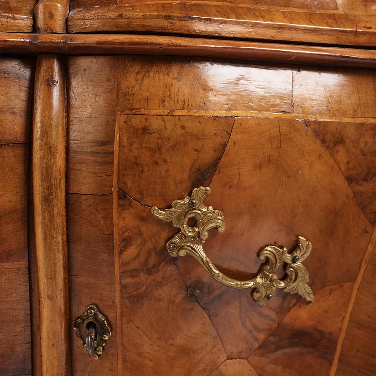 An Italian Louis XV-style bombé commode, 20th century.