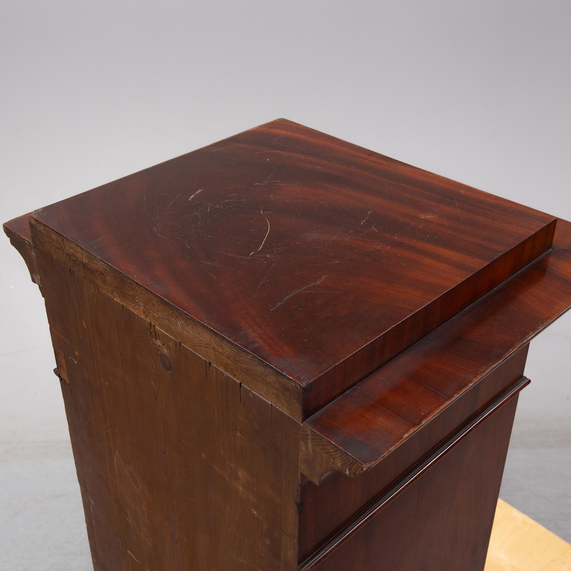 An early 19th Century empire mahogany cabinet.