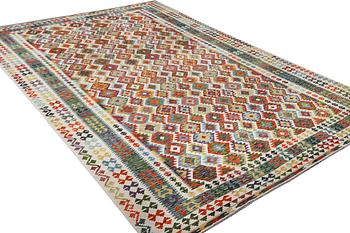 A Kilim carpet, c. 490 x 310 cm.