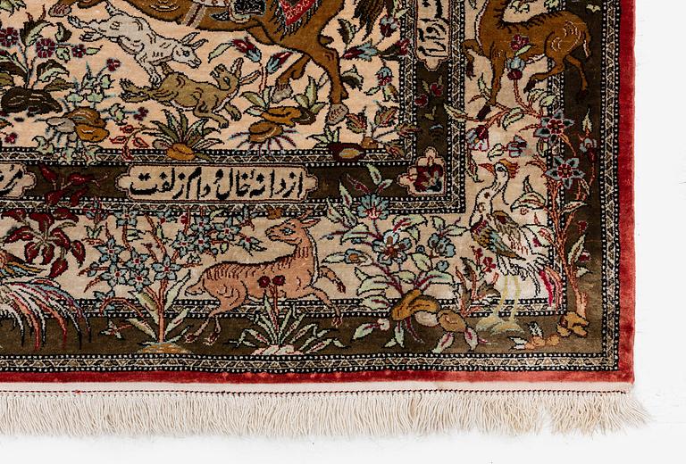 A silk Qum rug of 'hunting' design, c. 157 x 108 cm.
