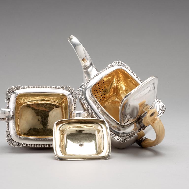 A Baltic 19th century parcel-gilt silver tea-pot and sugar casket, mark of Reinhold Eckert, Riga 1828.