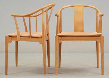 A pair of Hans J Wegner cherrywood and beige leather 'China chairs', Fritz Hansen, Denmark 1988.