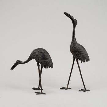 A pair of Chinese metal cranes, first half of the 20th century.