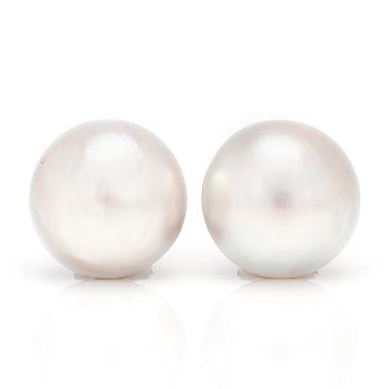 A pair of earrings set with cultured mabé pearls.