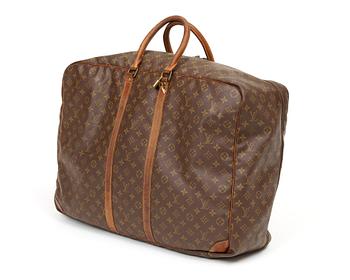 571. A monogram canvas softsided suitcase by Louis Vuitton.