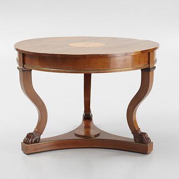 A mahogany veneered Empire style table, first half the 20th Century.