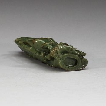 A  carved green stone sculpture, late Qing dynasty.