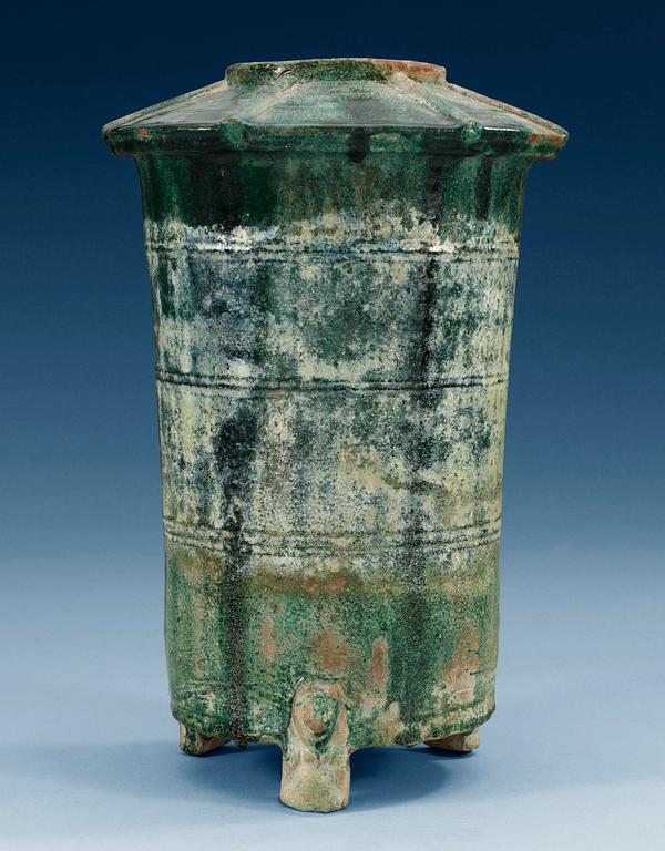 A green glazed grain storage, Han dynasty (206 BC -220 AD).