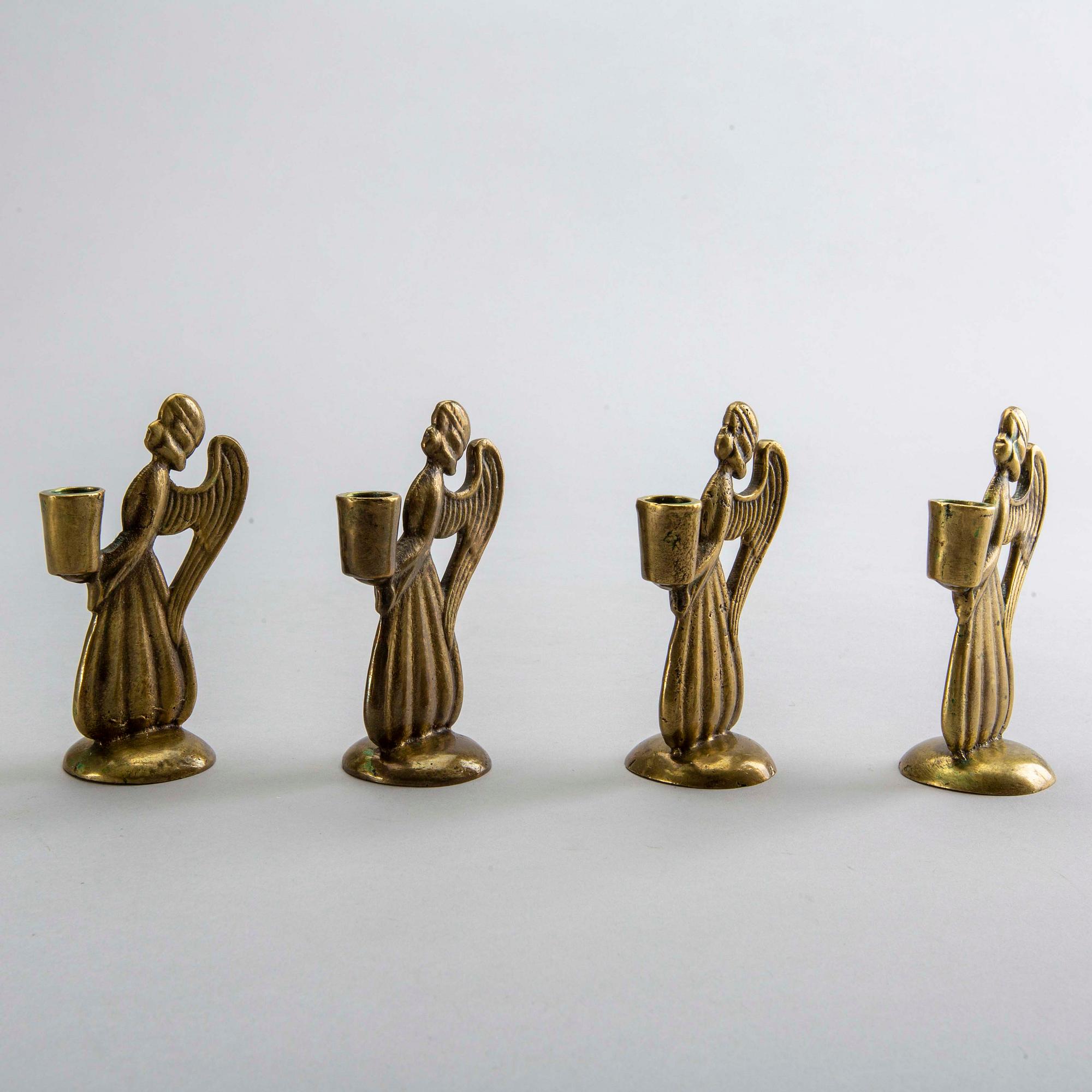 Four second half of the 20th century brass CANDLESTICKS.