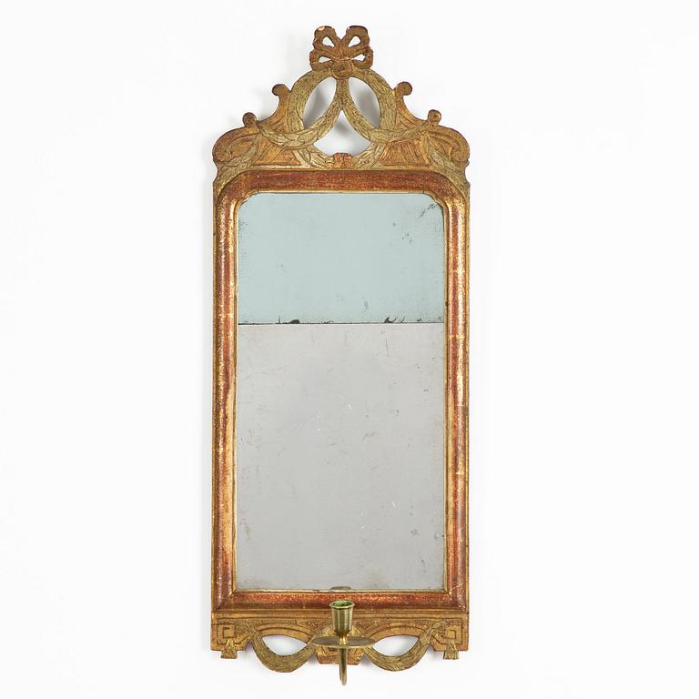 A  Gustavian giltwood one-light girandole mirror by N. Sundström (master in Stockholm 1754-1781).