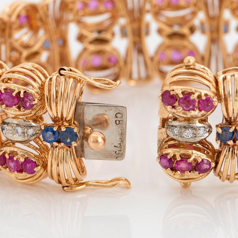 An 18K gold Bucherer bracelet set with blue and pink sapphires and round brilliant-cut diamonds.