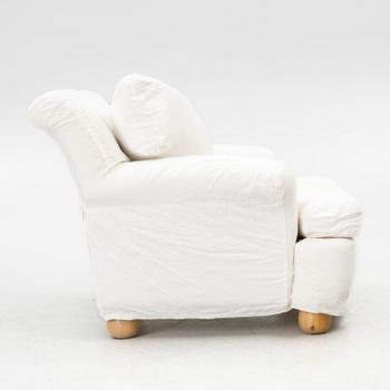 An armchair, contemporary.