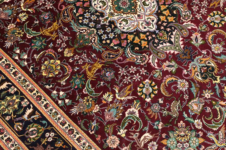 A part silk Tabriz rug, so-called 50 Radj, approx. 200 x 148 cm.
