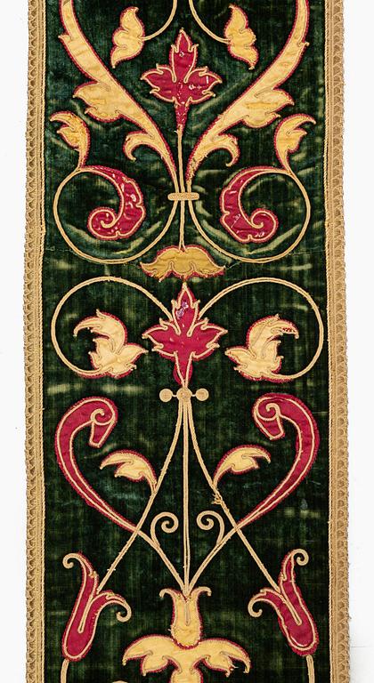 A 17th century Spanish embroidered velvet panel, c. 77 x 18.5 cm.
