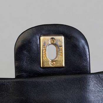 CHANEL, a black leather shoulder bag, "Double Flap".