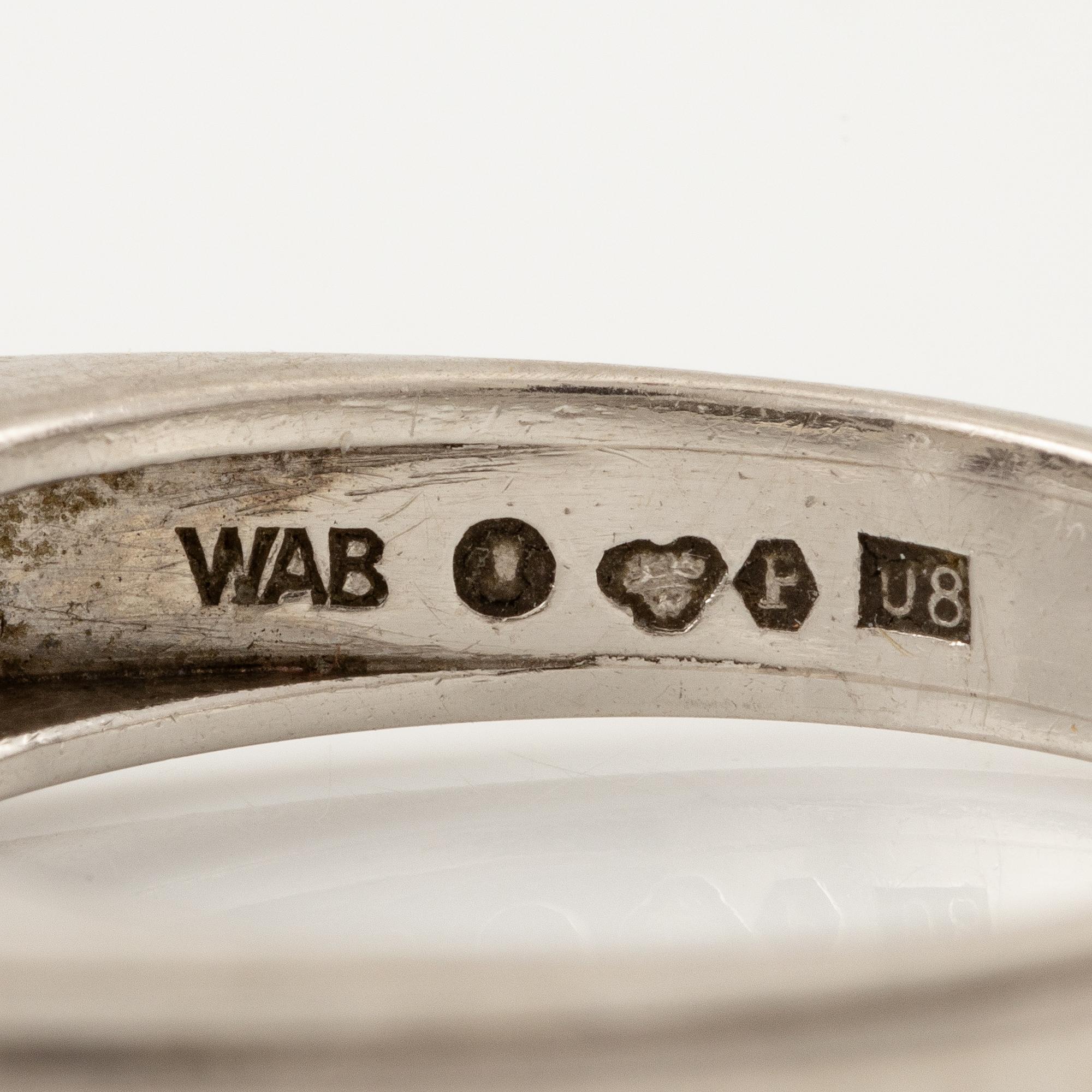 A W.A. Bolin ring in platinum with a pearl and round brilliant-cut diamonds.