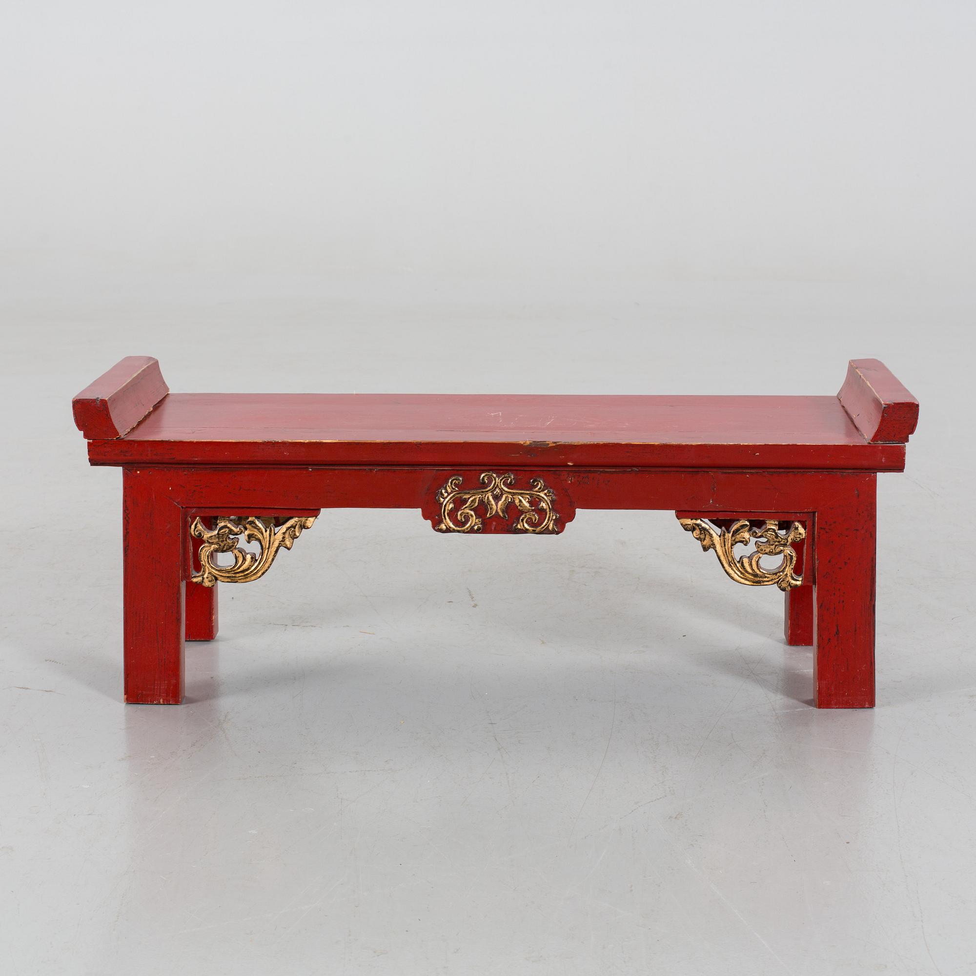 A Chinese 20th century painted wooden bench.