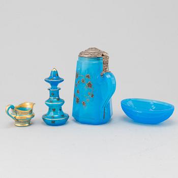 A silver gilt turkoise glass tankard, bottle with stopper, bowl and a small creamer, 19th Century.