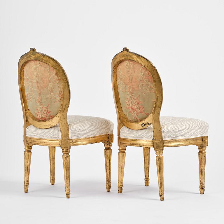 A pair of Gustavian giltwood chairs, Stockholm, late 18th century.