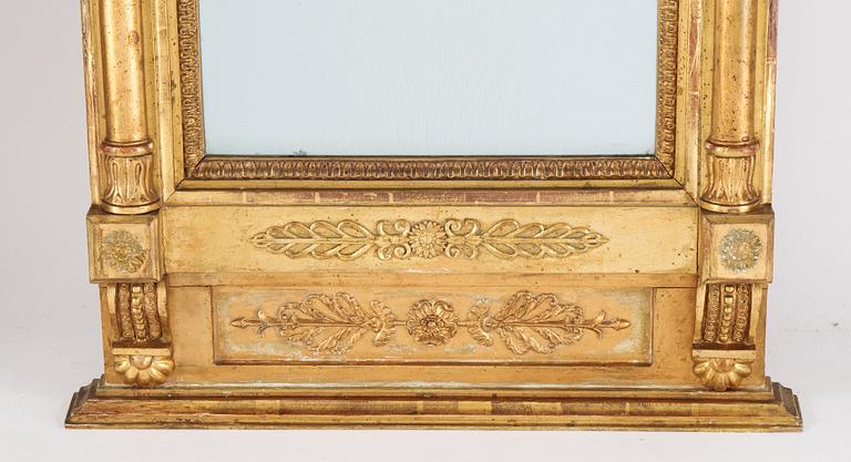 An Swedish Empire mirror, first half of the 19th century, attributed to Petter Gustaf Bylander, (Gothenburg 1802-59).