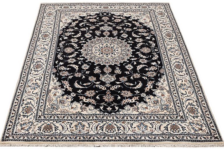 A carpet, Nain, part silk, ca 307 x 198 cm.