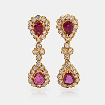 A pair of 18K gold earrings set with faceted rubies and round brilliant-cut diamonds.