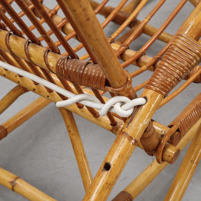 A rattan lounge chair.
