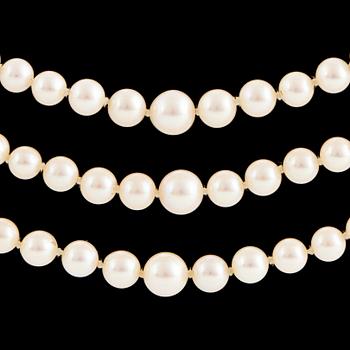 A three strand cultured pearl necklace.