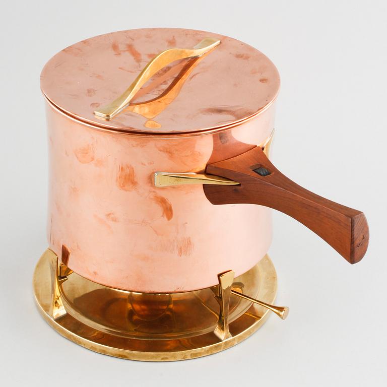 A copper pot with rechaud by Jens Quistgaard, third quarter of the 20th century.