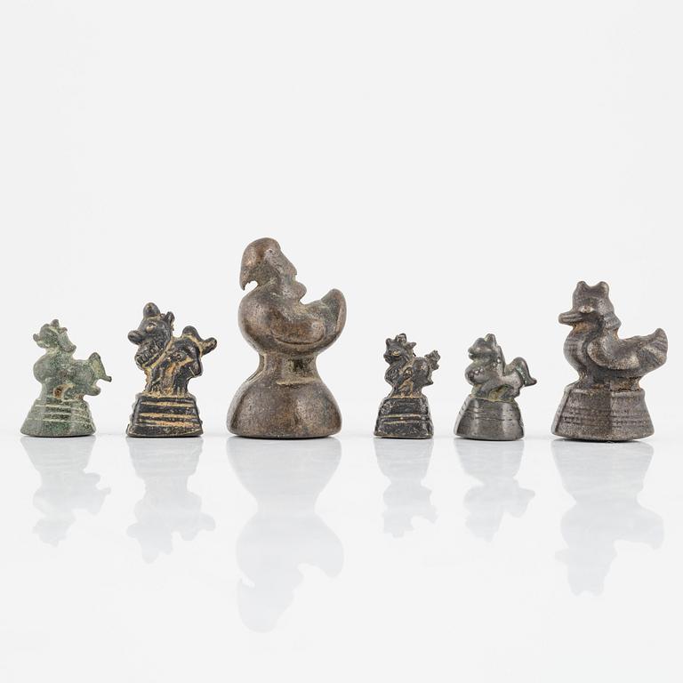 A group of six Burmese opium weights, 19th/20th Century.