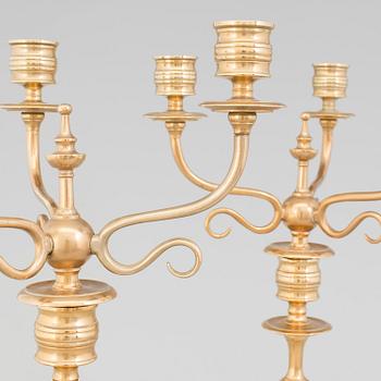 A pair of Candelabra, in brass Westerås Metallfabriks AB, late 19th century.