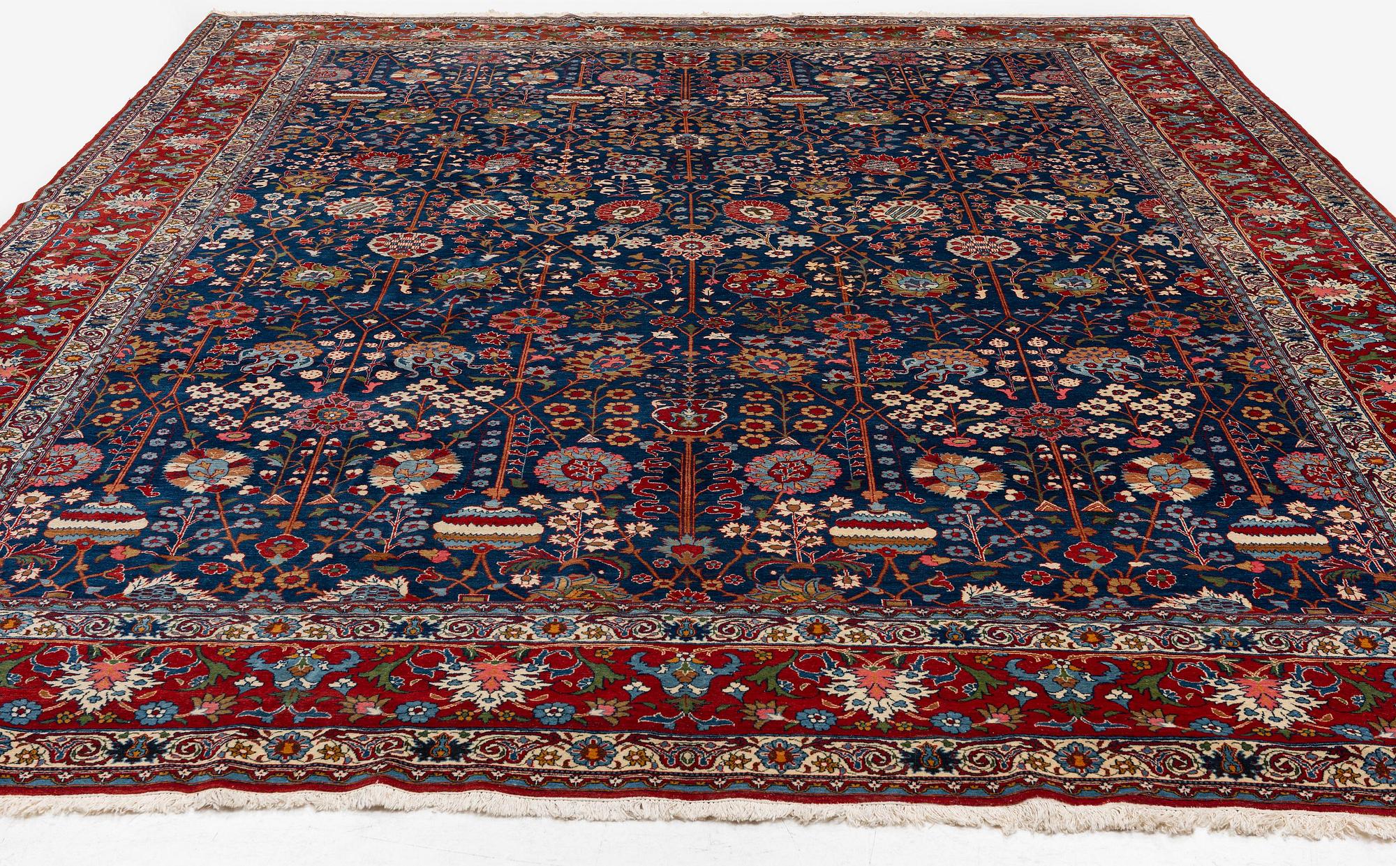 A semi-antique Qum carpet of Safavid design, Central Persia (Iran), c. 416 x 315 cm.
