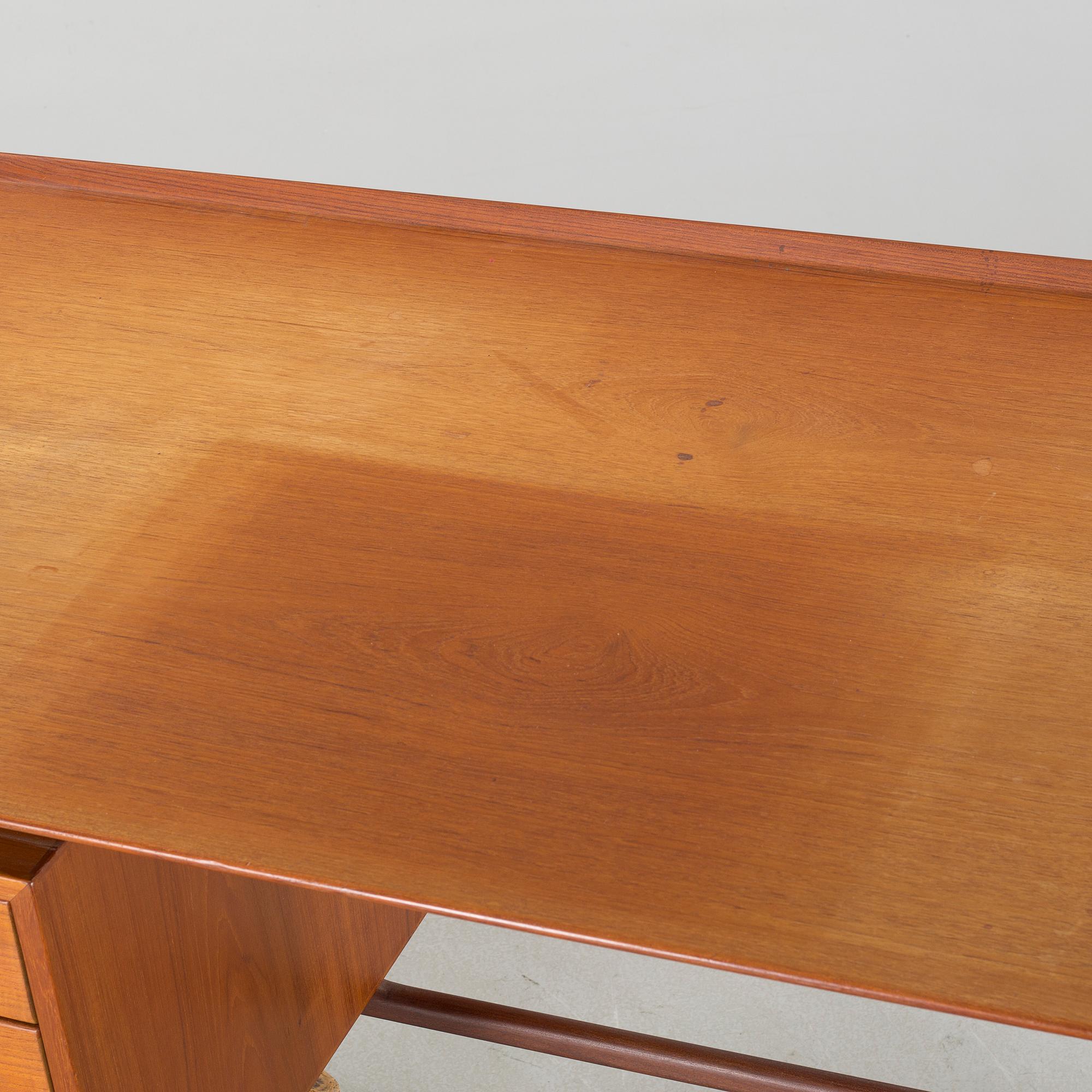A writing desk, designed by Arne Vodder for Vamo Møbelfabrik, third quarter of the 20th century.