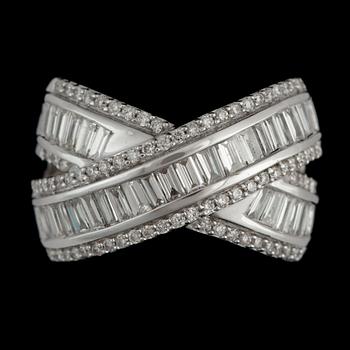 A brilliant- and baguette-cut diamond ring. Total carat weight circa 1.50 cts.